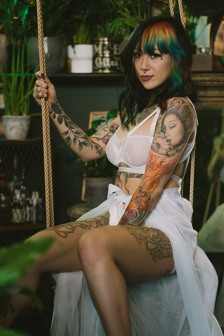 Kosmic Kitty, posing for a photo taken by Sinner Vision