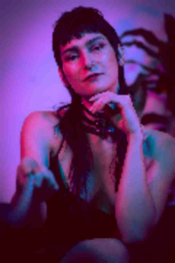 Emily, posing for a photo taken by Sinner Vision