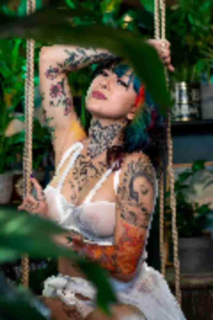 Kosmic Kitty, posing for a photo taken by Sinner Vision